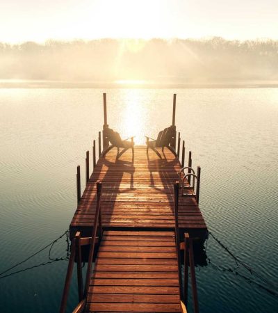 brown wooden dock on body of water during daytime