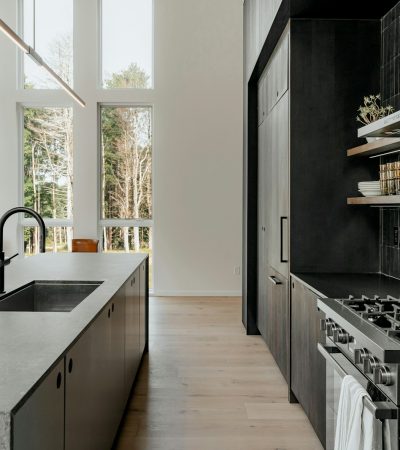 a kitchen with a stove top oven next to a window