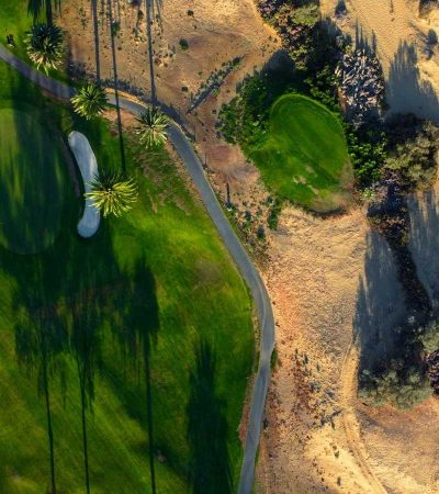 an aerial view of a golf course in the desert