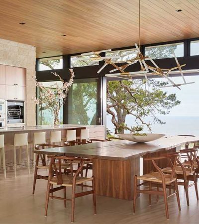 luxury kitchen with large wooden modern table