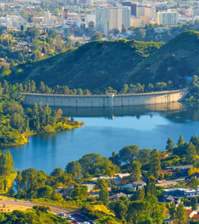 a body of water with a body of water and a city in the background