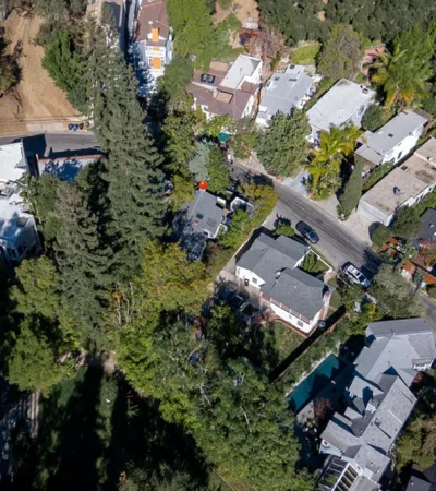 aerial view of a neighborhood with trees and houses