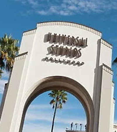 a large white archway with a sign
