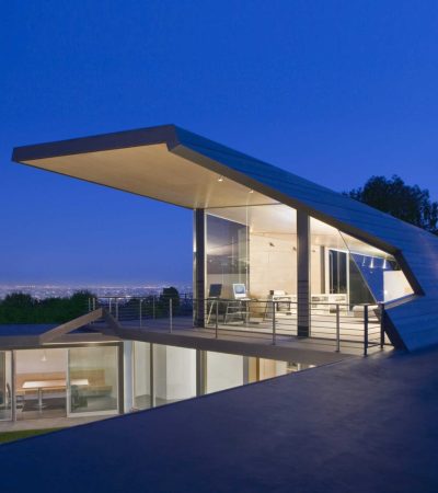 two level modern luxury home with large glass windows