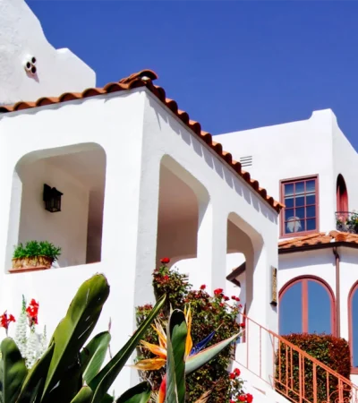 a white building with a red staircase