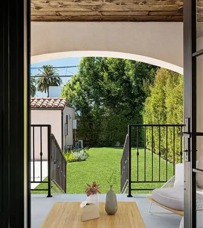 a patio with a chair and a table on it