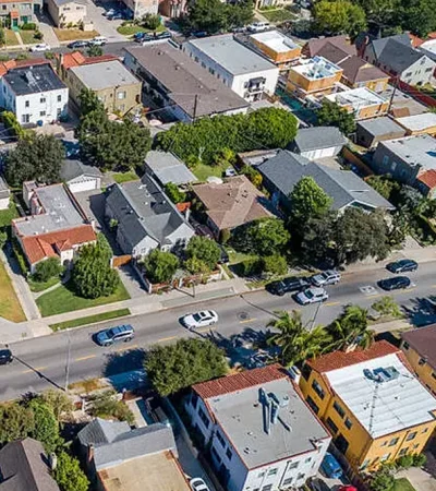 aerial view of a neighborhood with cars and buildings