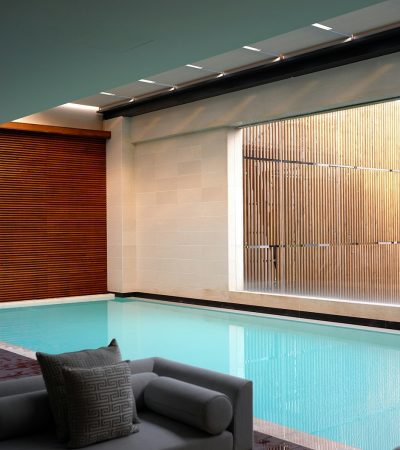 two gray sofas beside pool in room