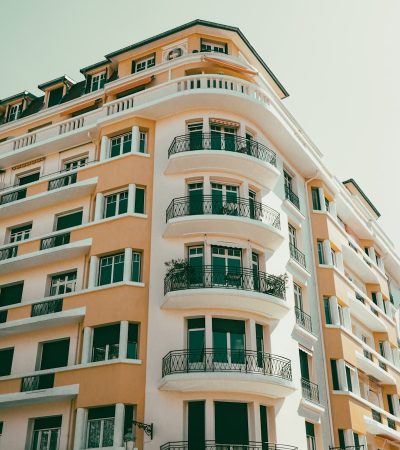 a tall building with balconies and balconies on the top of it