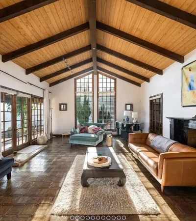 a living room with a fireplace and couches