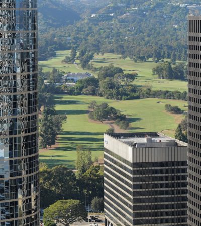 a couple of tall buildings sitting next to each other