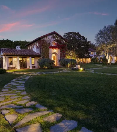 a house with a lawn and a walkway