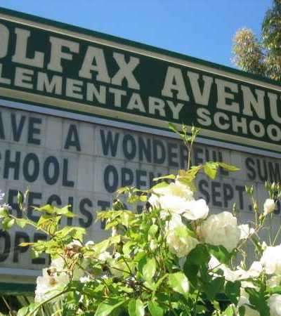 close up of school sign with yellow letters