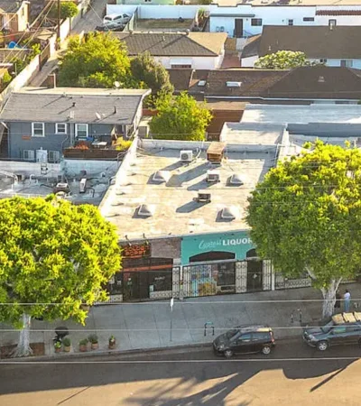 a street with cars and trees