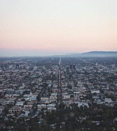 aerial view of city under cloudy sky