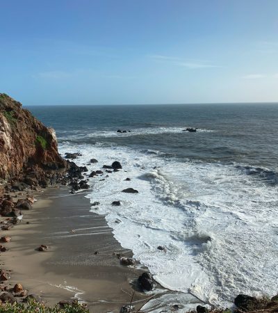 a view of the ocean from the top of a cliff