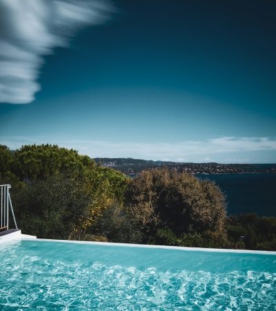 a swimming pool with a view of the ocean