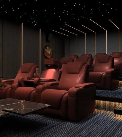 a room filled with red chairs and a table