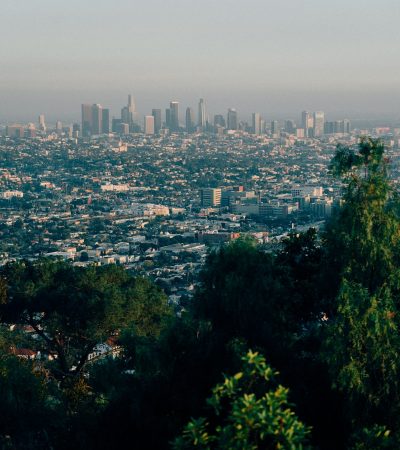a view of a city from the top of a hill