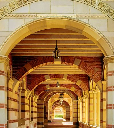 a hallway with a ceiling and arches