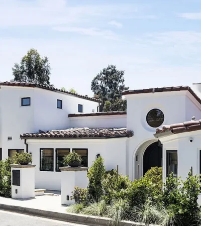 a white house with a large balcony