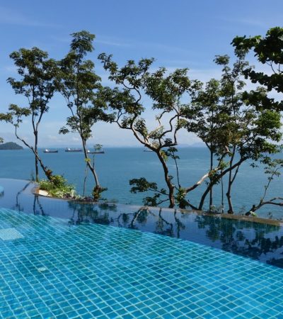 infinity pool with background view of open sea at daytime