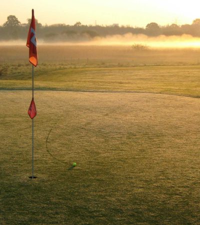 photo of red flag on golf course