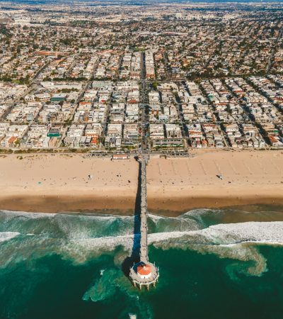 an aerial view of a beach and a city