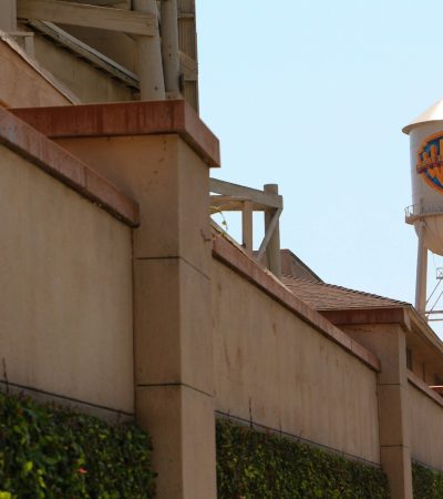 a tall water tower sitting next to a building