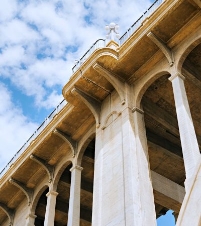 a very tall bridge with some pillars under it