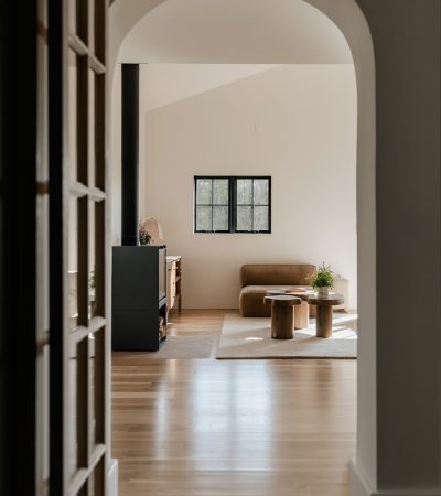 A hallway leading to a living room and dining room