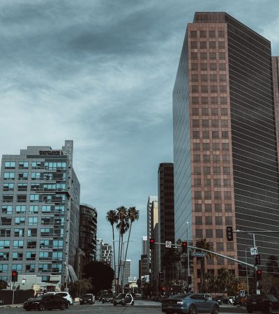 a couple of tall buildings sitting next to each other