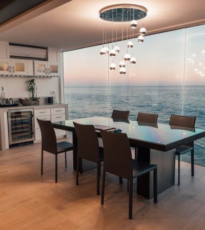 dining table set placed beside glass window