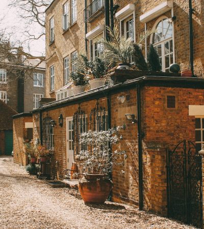 brown concrete brick house with plants placed outside
