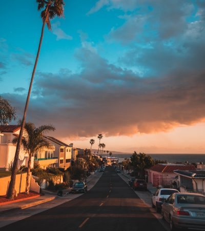 gray asphalted road with vehicle parked beside
